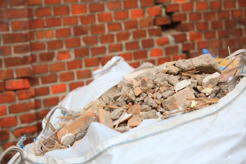 Workers managing builders waste for clearance in Paddington
