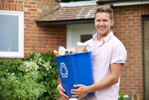 Technician removing weeds and debris from a garden